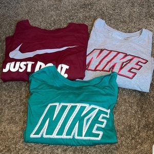 3 men’s Nike shirts.